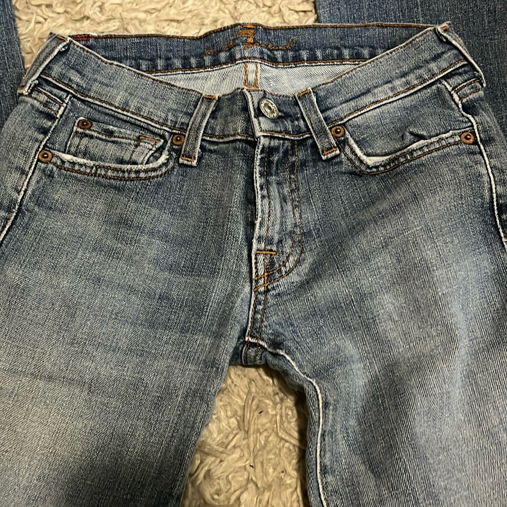 Seven for all Mankind medium wash straight jeans.
